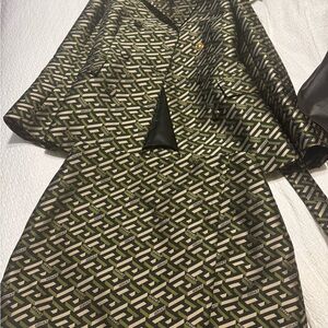 Authentic Versace jacket and skirt. Only wore once in excellent condition.